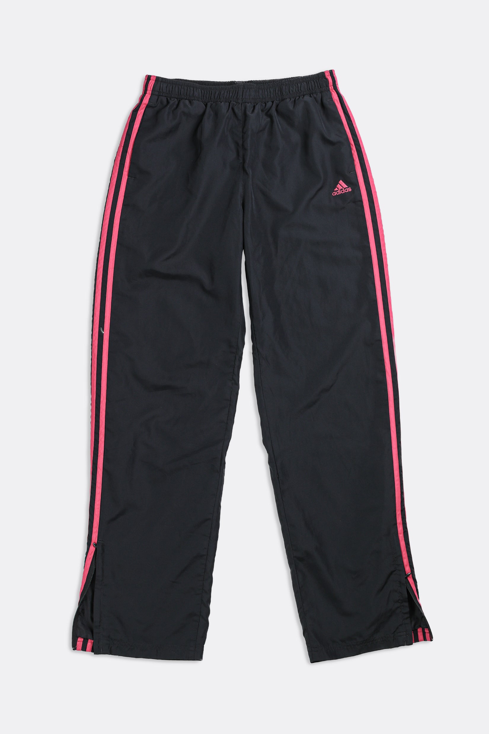 Adidas Response women wind pants black and pink detail zip ankles. Size M.  Used.